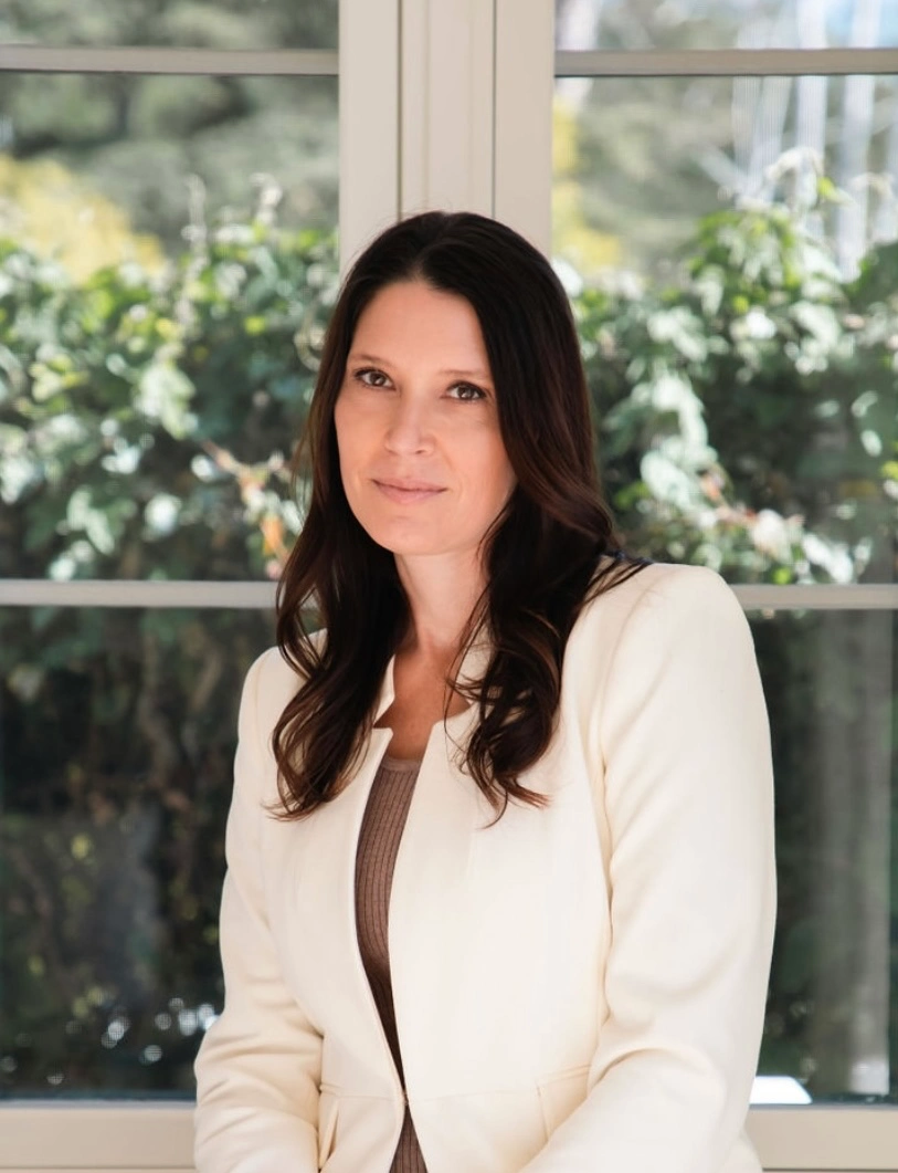 Angela Greenspan portrait in front of a window