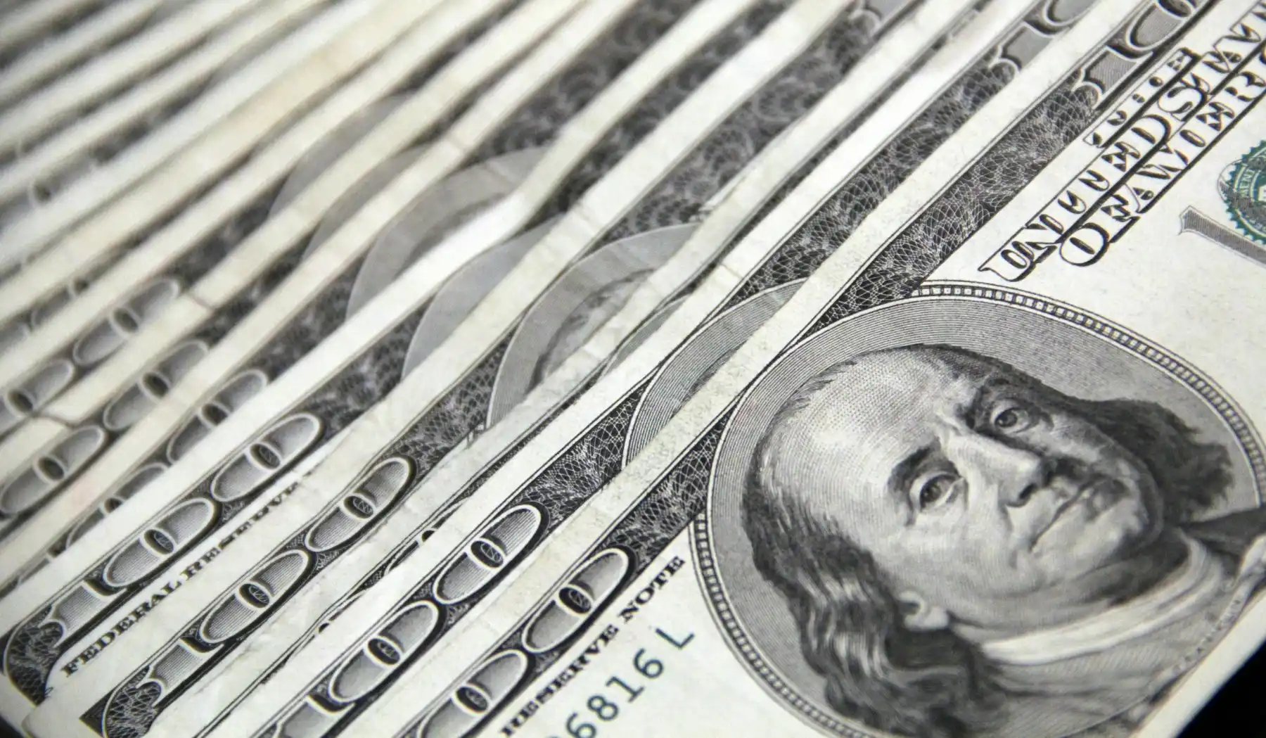 stack of hundred dollar bills