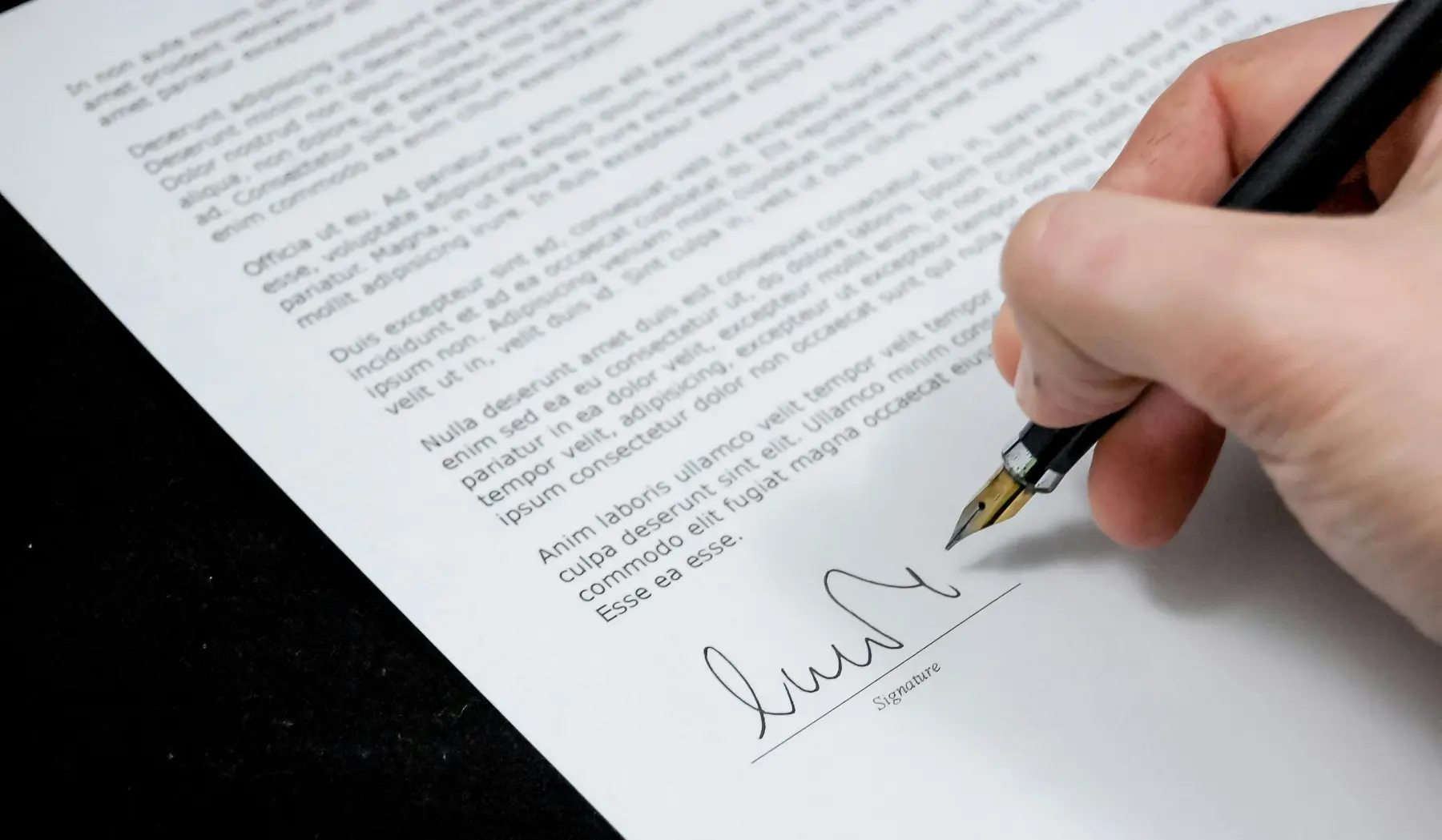 hand signing a contract
